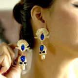 Gold Skull Drop Earrings with Blue Stone