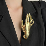 Golden Hand Statement Brooch